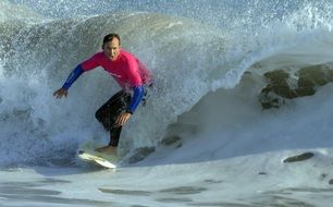 surfer on a surfboard on the wave