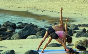 people are doing yoga exercises