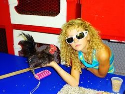 girl with little black chicken