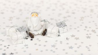 santa claus sitting among gift boxes, christmas decoration