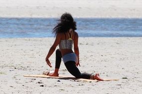 The girl on the beach is relaxing