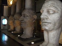 sculpture male heads on legs as bases of columns, japan, osaka, Dotonbori Hotel