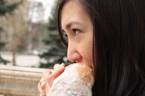 girl eating a hotdog