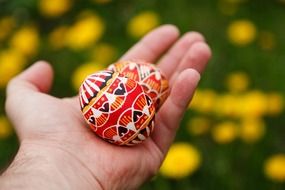 two painted eggs lie in hand