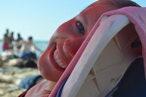 smiling lying girl and sunny weather