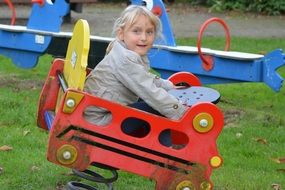 child playing on a children's playground
