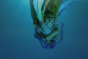 girl is swimming underwater