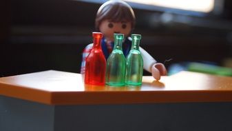 playmobil man and bottles toy