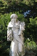 white historical female sculpture in the park