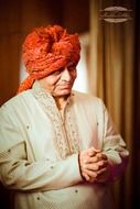 old praying Indian man