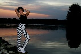 girl posing by the water