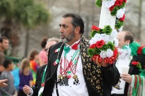 man with flowers on irish parade