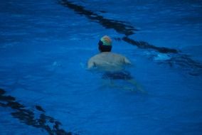 swimmer in the blue pool