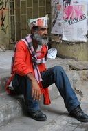 homeless man sitting on the step