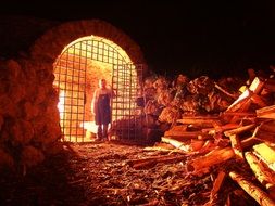 a guard stands near the fire