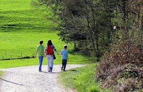 family on hiking trail at spring