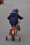 boy on the bike with training wheels