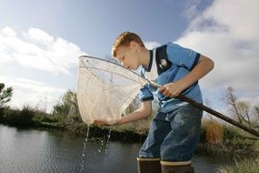 fish catches boy