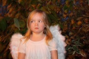 little girl dressed as an angel