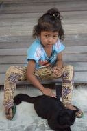 thai girl with a black cat