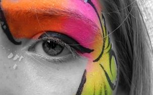 painted butterfly on the girl's face close-up