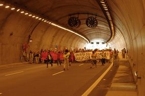 crowd of protesting people in the tunnel