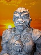 stone statue of a soldier from mythology