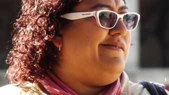 portrait of a happy woman in sunglasses