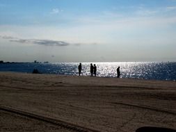 people on Mississippi Gulf Coast at dusk, usa, MS