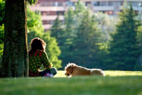 girl with dog on grass