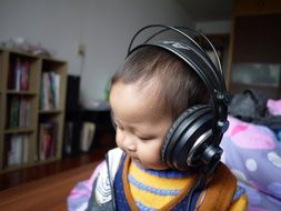 kid with big black headphones
