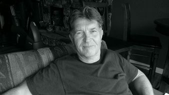 Black and white photo of the relaxed man