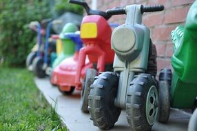 Colorful children's small bikes in the garden