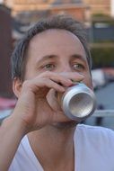 man is drinking beer