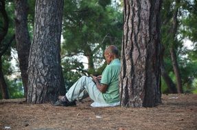 photo of the lonely man in a forest