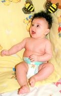 little baby on a yellow blanket