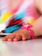 children's hand with a bracelet
