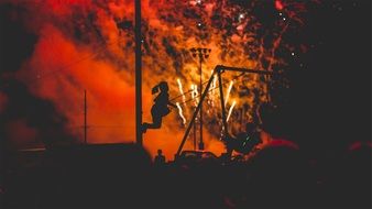 girl on a swing in the background of the salute