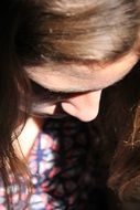 Crestfallen girl is looking down