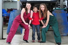 two girls and a boy in the service station