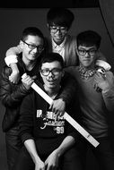 four friends in a black and white photo