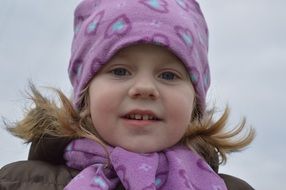 smiling girl with pink hat