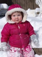 little girl in pink down jacket