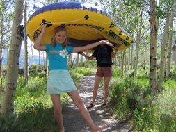 young people under the rubber boat