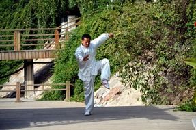 man doing kung fu in the street