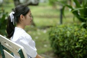 asian girl sitting on the bench