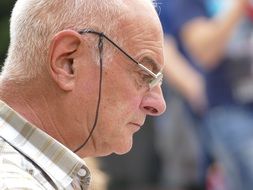 old man with glasses in profile