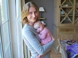 smiling happy mother with baby