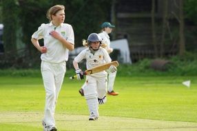players running cricket batter game