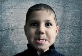 child boy showing teeth